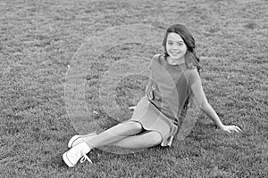 Summer vacation. Vacation ideas. Happy smiling girl enjoy relax on lawn. Cheerful schoolgirl. Have fun. Girl cute kid