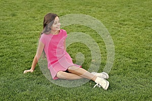 Summer vacation. Vacation ideas. Happy smiling girl enjoy relax on lawn. Cheerful schoolgirl. Have fun. Girl cute kid