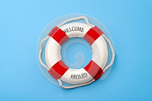 Summer vacation, welcome aboard and safety equipment for swimming concept with white and red life buoy or lifesaver isolated on