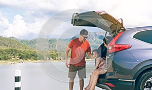 Summer vacations.Happy family enjoying trip with their favorite car. Holiday and travel family concept