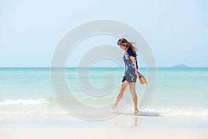 Summer vacations. Lifestyle woman relax and chill on beach background.