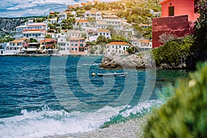 Summer vacations scenery. Mediterranean town Assos on Kefalonia in Greece. View of beautiful beach and colored houses