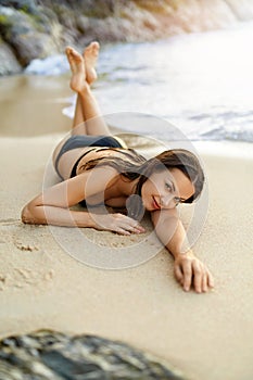Summer Vacations. Woman Lying On Beach. Healthy Lifestyle. Travel, Wellness.