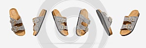 Summer Vegan cork sandals with straps floating from different sides on light gray background. Fashionable female trendy slippers.