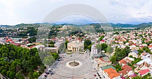 Summer view of the city of Kutaisi, Georgia. David Agmashenebeli Square, Theater named after Lado Meskhishvili and old photo