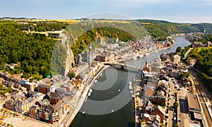 Summer view of Dinant cityscape on banks of river Meuse, Belgium