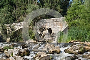 Summer view of Kadin most - a 15th-century stone arch bridge over the Struma River at Nevestino, Bulgaria