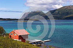 Summer view of Lofoten Islands with red rorbu