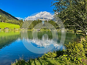 Summer view of Selva dei Molini lake in Alto Adige