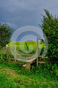 Summer view of a stile in English countryside.