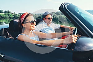 Summer voyage in cabriolet car: couple in love ride in car