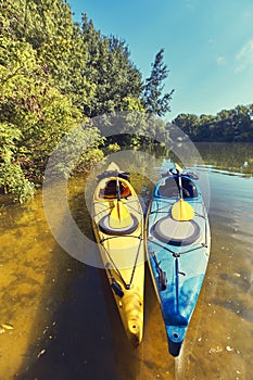 A summer walk along the river on kayaks on a sunny day.