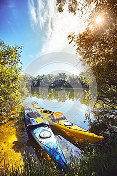 A summer walk along the river on kayaks on a sunny day.