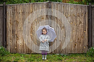 Summer walk in the rain little girl with an umbrella