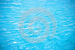 Summer water ripple in swimming pool abstract blue background