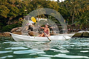 Summer Water Sport. Woman Traveling In Kayak Near Green Island