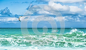 Summer watersport background of kite surfing and blue water