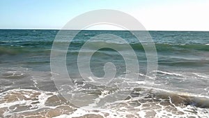 Summer waves break on a warm California Beach