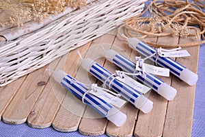 Summer wedding beach party favours white candles witn nautical blue stripes pattern decoration diy guest souvenirs