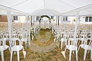 Summer wedding tent decorated for secular wedding ceremony