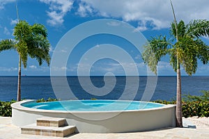 Summer and winter vacation destination, views of Curacao island with private swimming pool, and blue water of Carribean sea