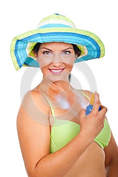 Summer woman applying sun protection cream