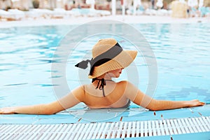 Summer Woman Body Care. Beautiful Sexy Girl With Healthy Skin In Elegant Striped Bikini, Sun Hat Relaxing In Swimming Pool