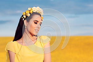 Summer Woman with Roses Wreath in a Field of Flowers