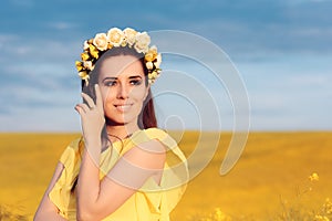 Summer Woman with Roses Wreath in a Field of Flowers