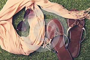 Summer womens fashion accessories on grass background