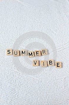 Summer word lettering on sand background, beach mood, copy space
