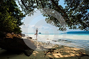 Summer yoga session in beautiful tropical island photo