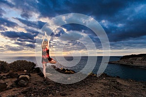 Summer yoga session on tropical island photo