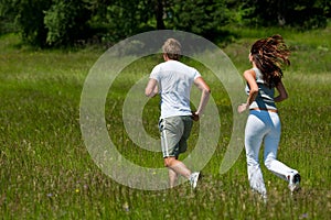 Summer - Young couple jogging in nature