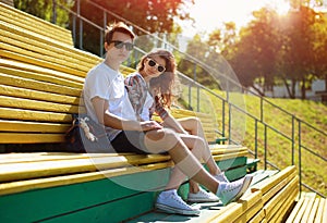 Summer young modern stylish couple in sunglasses rest