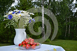Summerflowers and strawberries