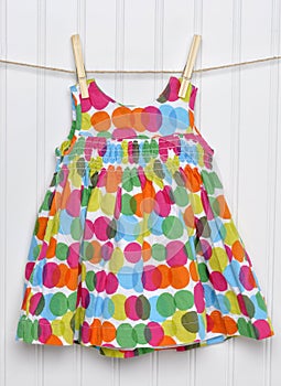 Summertime Baby Girl Dress on a Clothesline.