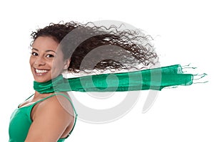 Summertime: Crazy woman in green with blowing hair in wind isolated.