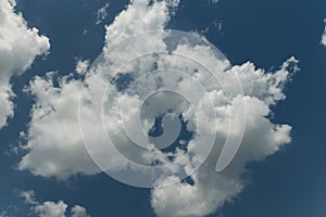 Summertime Cumulus Clouds on a Blue Sky Background