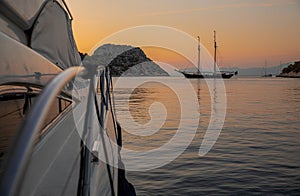 Summertime after sunset luxury yacht anchored in the Aponissos bay, Agistri island, Saronic gulf, Greece