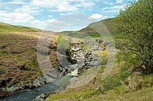 Mountain waterfall in the Elan valley of Powys, Wales. photo