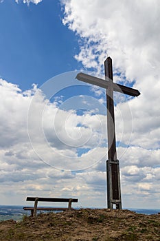 Summit cross and bench at hill Rodenstein in Franconian Switzerland, Germany