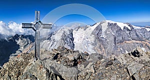 Summit cross on the Bifertenstock Piz Durschin. Fantastic view of the Piz Russein Todi. Glacier tour in the Glarus Alps