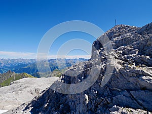 Summit cross of Sulzfluh, Raetikon on a sunny day. Vorarlberg, Austria.