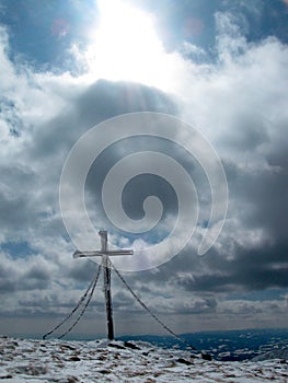 Summit cross on top of the mountain, alps, europe