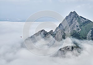 Giewont mountain massif above the fog photo