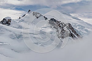 The summit of Mont Blanc, highest mountain range in the Alps, seen from the Aiguille du Midi