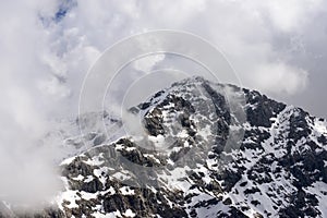 Summit of Tre Signori peak among clouds, Orobie