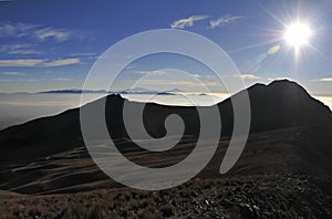 Summit view from Nevado de Toluca with low clouds in the Trans-Mexican volcanic belt, Mexico photo