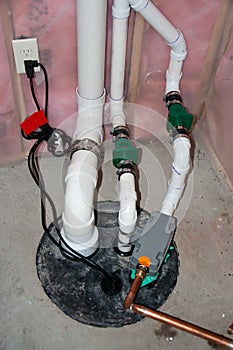 Sump pump manhole with water backup and radon mitigation